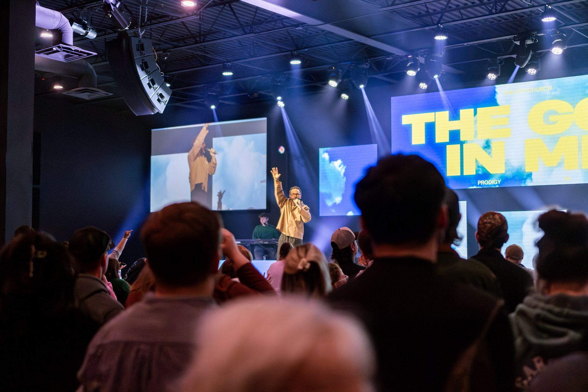 A full room during a Sunday service in Ashtabula, with the speaker on stage